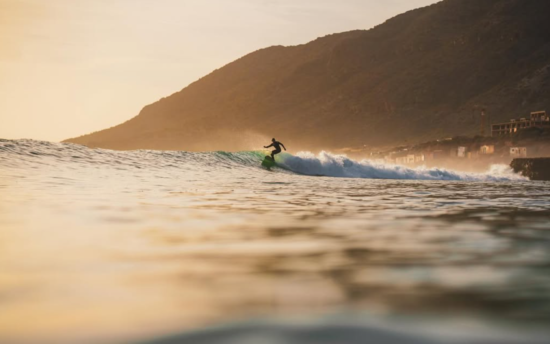 surfing in morocco during sunset